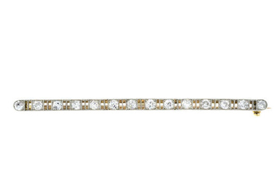An early 20th century gold diamond line brooch.