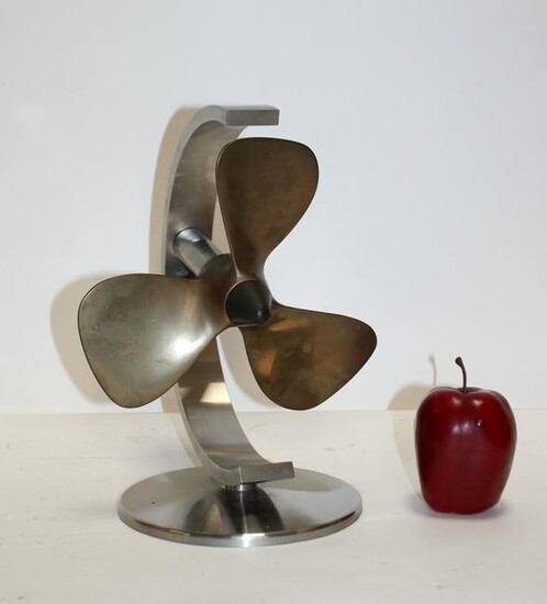Bronze propeller sculpture on stainless steel stand