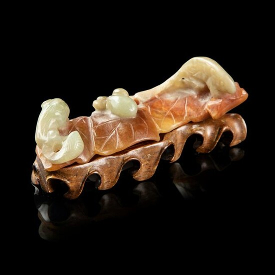 CELADON JADE WITH RUSSET SKIN BRUSH REST QING DYNASTY