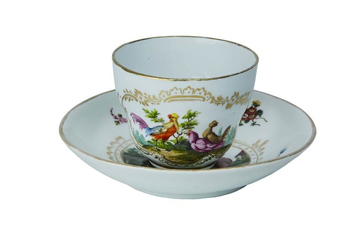 Cup and saucer Tea cup with flared handle and saucer....