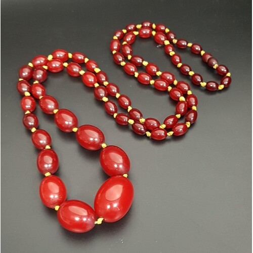 GRADUATED AMBER BEAD NECKLACE with individually knotted bead...