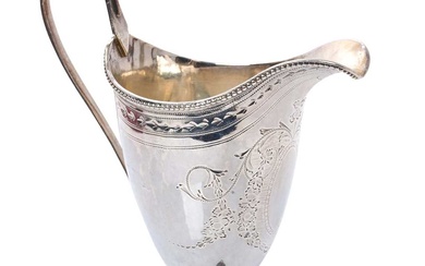 George III silver cream jug of helmet form, with engraved decoration