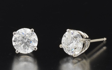 Ladies' Pair of Gold and Diamond Solitaire Ear Studs