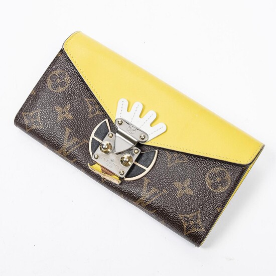 SOLD. Louis Vuitton: A "Jaune Tribal Mask Sarah Wallet" of brown mongoram canvas and yellow leather with gold and silver tone hardware. – Bruun Rasmussen Auctioneers of Fine Art