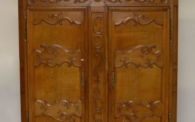 Louis XV style wardrobe in carved oak opening...