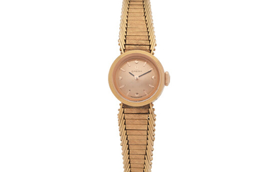 Omega. A lady's 18K gold manual wind bracelet watch Ref 7119, Circa 1962