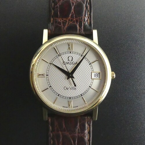 Omega De Ville gents 18 carat gold date adjust quartz watch....