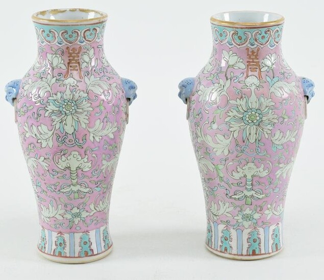 Pair of porcelain vases. China. 19th century. Lion mask