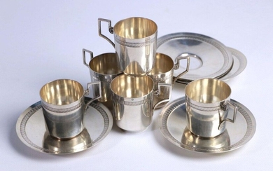 Suite of six cups and their silver saucers with Empire style water leaf decoration.