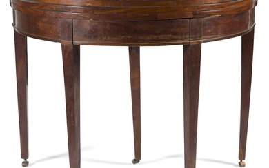 Table console demi-lune du début du XIXe siècle. En acajou et placage d'acajou et granit...