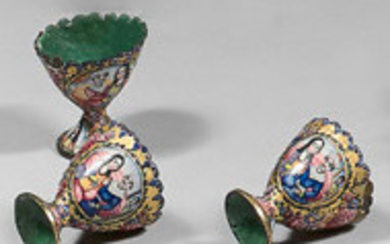Three zarfs with honeycombed edges with enamelled decoration,...