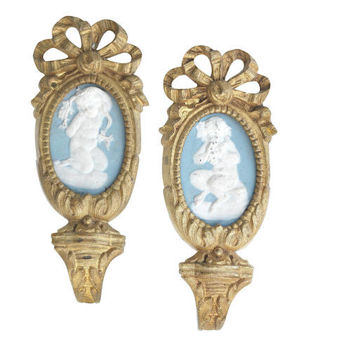 Two 19th century gilt brass and wedgewood style porcelain curtain tie backs