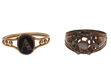 Two diamonds and enamel rings with an “A”, late 19th Century.