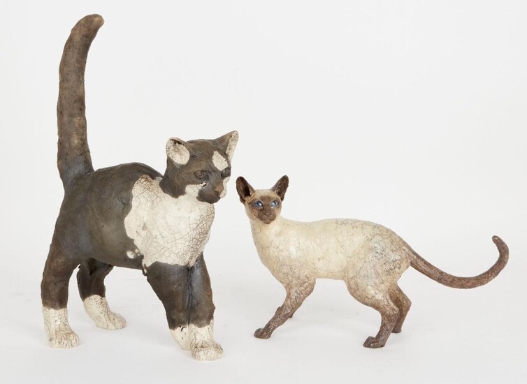 Walter Awlson (Scottish, b.1949), a studio pottery cat in a standing pose with front legs crossed, bearing impressed signature and numbered 63/75 to underside, 41cm high, 25.4cm wide, together with a ceramic figure of a Siamese cat by Sallie Wakley...