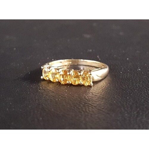 YELLOW GEM SET FIVE STONE RING possibly yellow sapphire, the...
