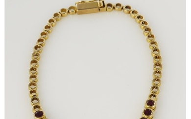 Yellow gold (tests 14ct) ruby bracelet, fourteen round rubie...