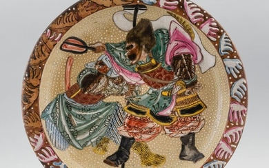 POTTERY CHARGER With moriage-style decoration of warriors surrounded by waves. Diameter 13.75".