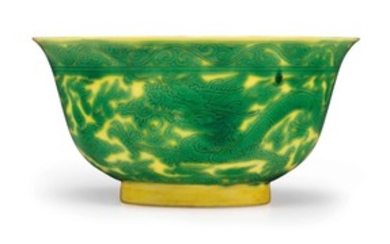 A YELLOW-GROUND GREEN-ENAMELED 'DRAGON' BOWL, KANGXI SIX-CHARACTER MARK IN UNDERGLAZE BLUE WITHIN A DOUBLE CIRCLE AND OF THE PERIOD (1662-1722)