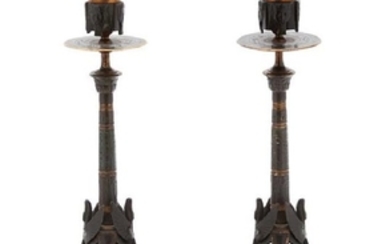 A Pair of Egyptian Revival Ebonized and Gilt Bronze Candlesticks