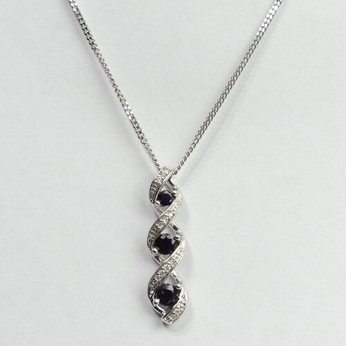 9 carat white gold sapphire and diamond pendant and chain, 4...