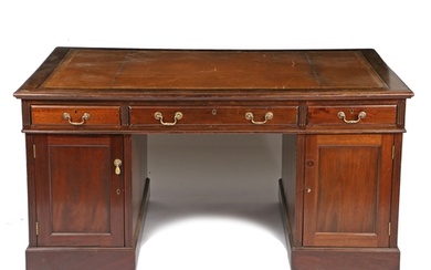A 19th century mahogany partners desk, having a brown and gi...