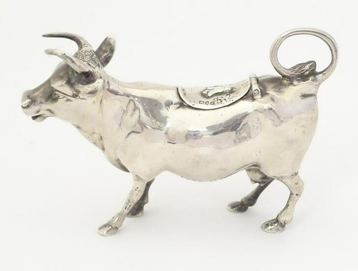 A 19thC Continental silver cow creamer with import