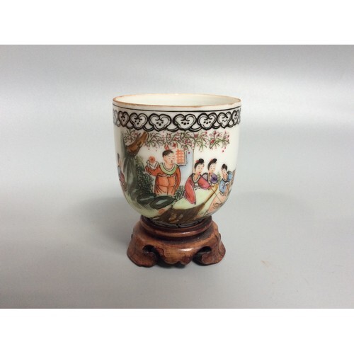 A 20th century Chinese porcelain wine cup, painted in polych...