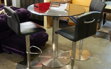 A BLACK GLASS TOPPED CIRCULAR TALL TABLE, WITH BRUSHED STEEL...