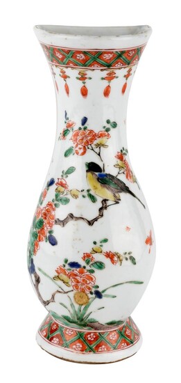 A Chinese famille verte 'bird and flowers' wall vase, Kangxi period, of baluster form with flattened back, painted with a bird perching on a prunus branch in between floral bands, 21cm high 清康熙 五彩繪花鳥紋壁掛瓶