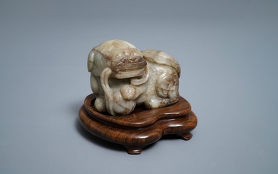 A Chinese pale grey brown jade model of...