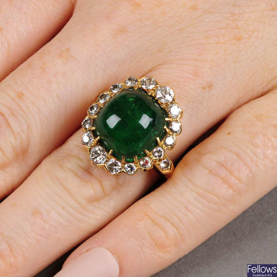A Colombian emerald cabochon and circular-cut diamond