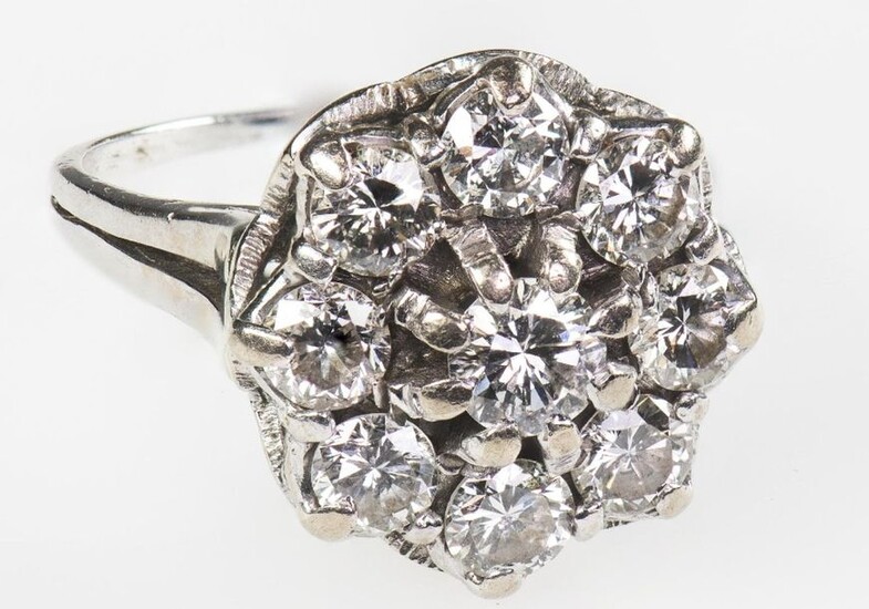 A DIAMOND CLUSTER RING, 1975