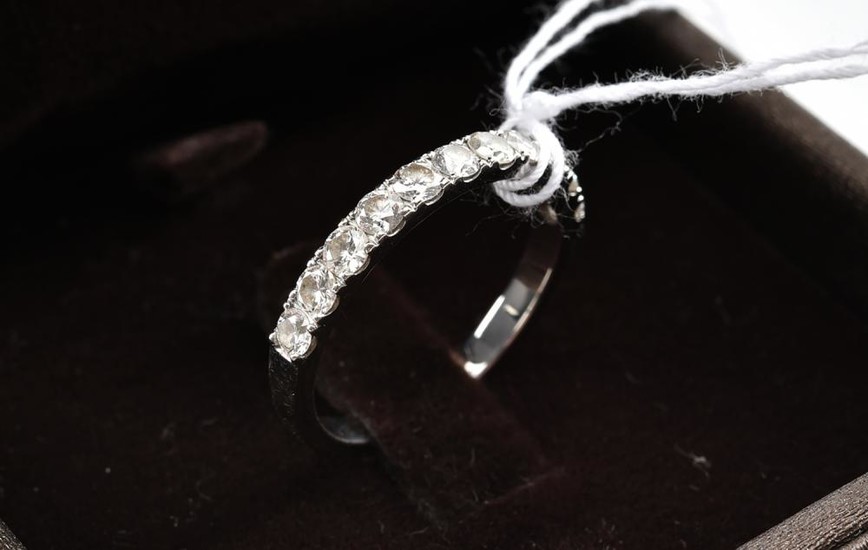 A DIAMOND HALF HOOP RING BY CARA IN 18CT WHITE GOLD