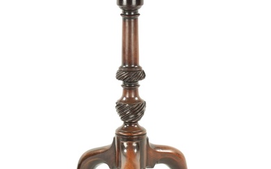 A GEORGE III FIGURED MAHOGANY CANDLE STAND with dished...