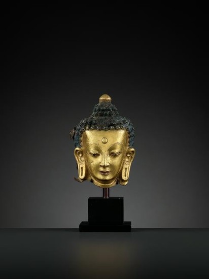 A GILT COPPER REPOUSSE HEAD OF BUDDHA, 18TH CT
