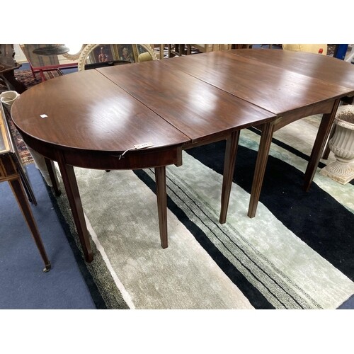 A George III mahogany D end extending dining table. 220cm ex...