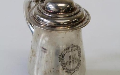 A George III sterling silver tankard, marked to the base...