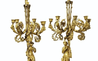 A PAIR OF CHARLES X ORMOLU AND WHITE MARBLE FIVE-LIGHT CANDELABRA, CIRCA 1825