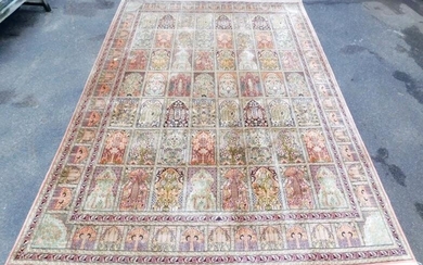 A Persian Heriz cream ground silk rug, with fifty...