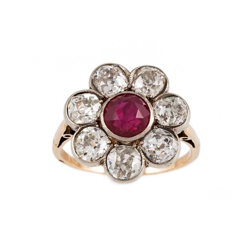 A RUBY AND DIAMOND CLUSTER RING, the circular cut ruby to a ...