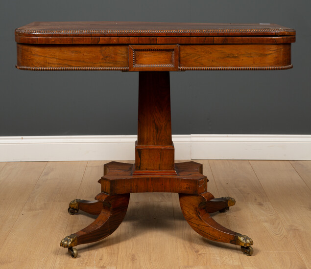 A Regency style rosewood fold over card table
