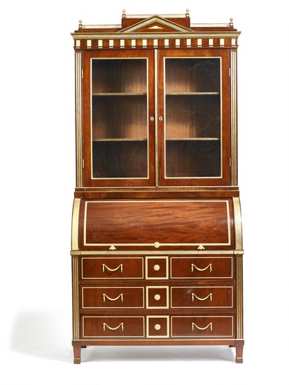 A Russian Neoclassical style mahogany bureau with vitrine cupboard. St. Petersburg, the bureau c. 1820, with later alteration and mountings.