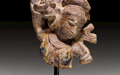 A SMALL STONE FRAGMENT OF A YAKSHI.