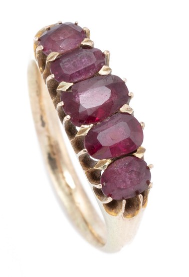 A VINTAGE GOLD RUBY RING; set across the top with five graduated oval cut rubies, gold 10-12ct, size M, wt. 3.63g.
