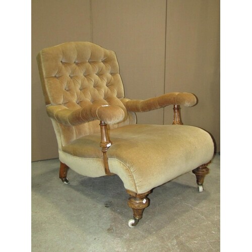 A Victorian drawing room/library chair with deep buttoned ba...