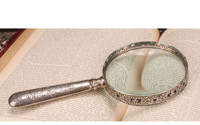 A Victorian silver magnifying glass, the bezel pierced and c...