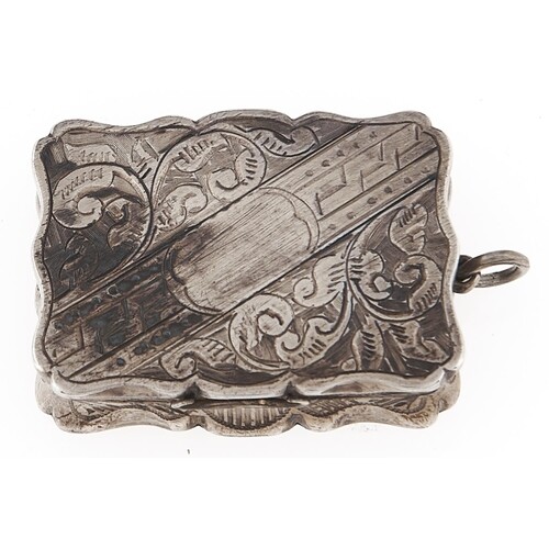 A Victorian silver vinaigrette, engraved with scrolling foli...