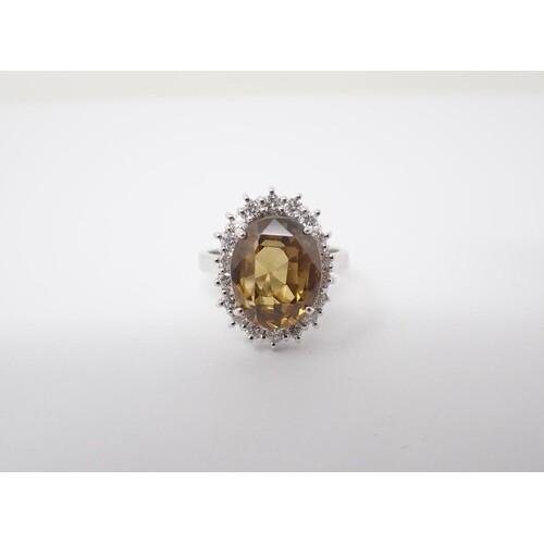 A Zircon and Diamond Cluster Ring claw-set oval mixed-cut ye...