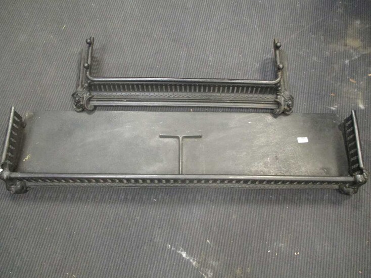 A black pierced steel fender 132cm wide together with a cast iron fender, 93cm wide (2)