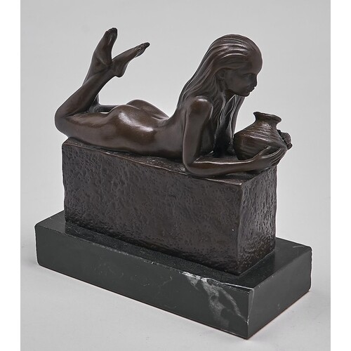 A bronze sculpture of a nude woman holding a jar, late 20th ...